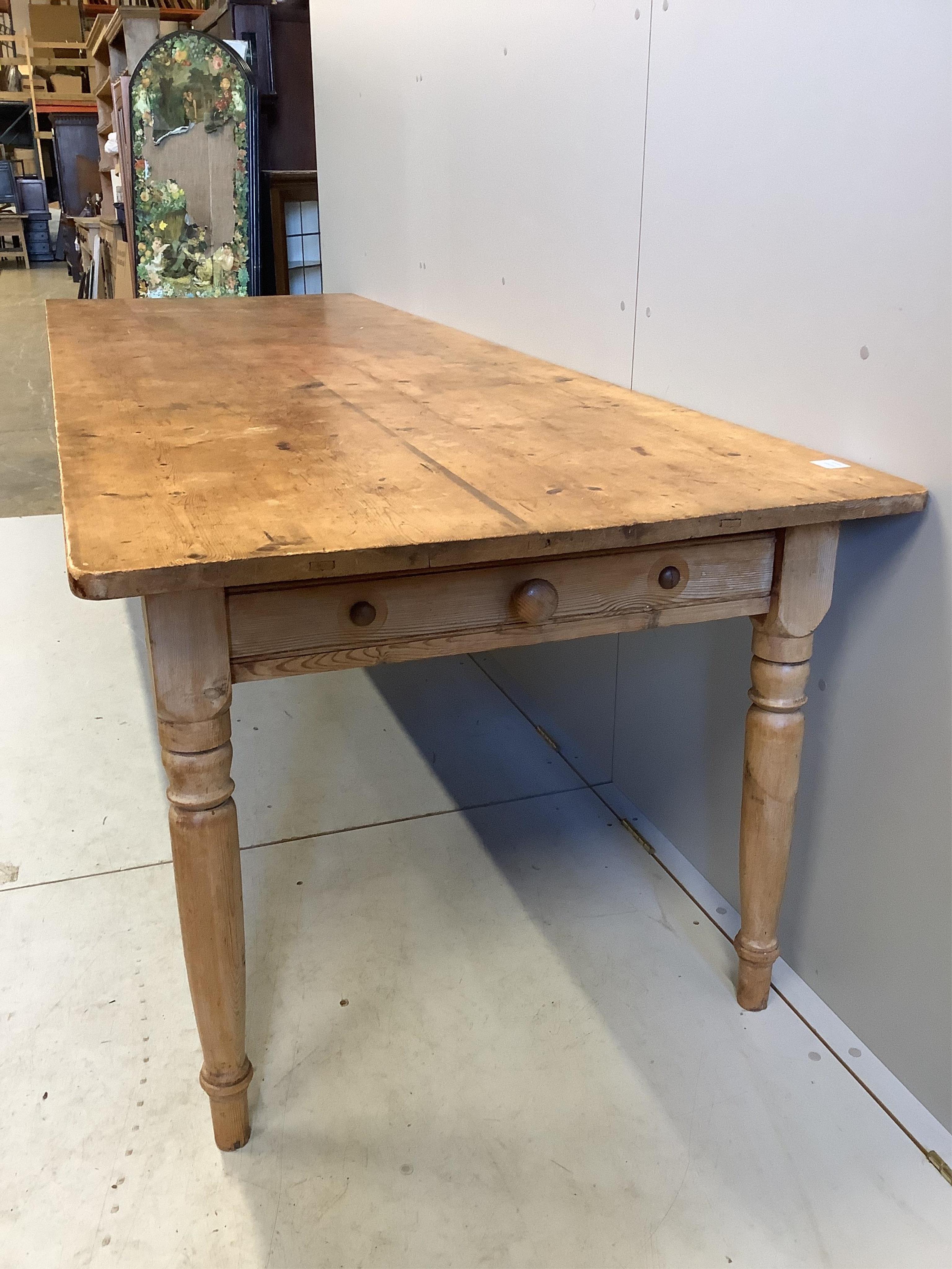 A Victorian rectangular pine kitchen table, fitted two drawers, width 275cm, depth 92cm, height 75cm. Condition - fair to good